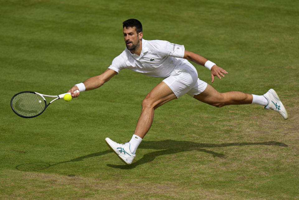 Serbia's Novak Djokovic returns to Spain's Carlos Alcaraz in the final of the men's singles on day fourteen of the Wimbledon tennis championships in London, Sunday, July 16, 2023. (AP Photo/Alastair Grant)