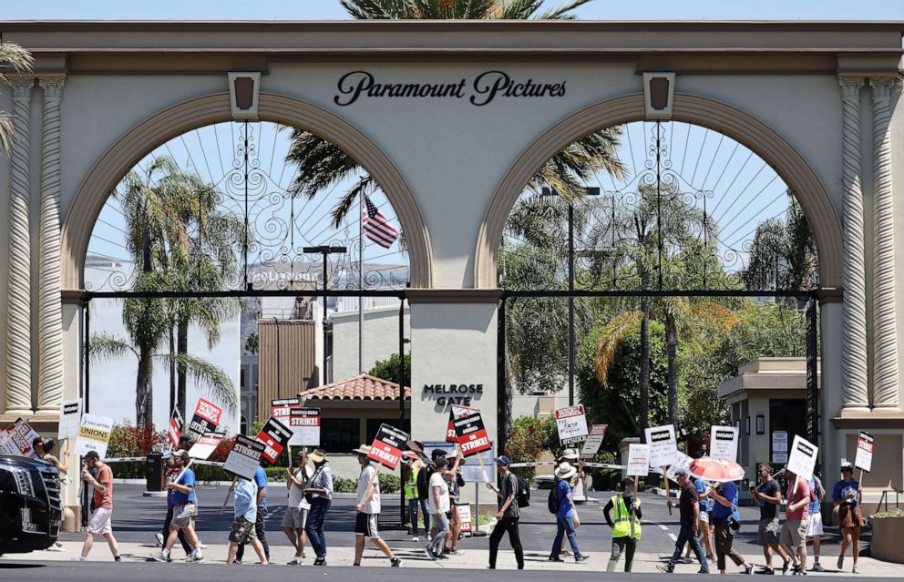 Striking WGA (Writers Guild of America) workers picket outside Paramount Studios.