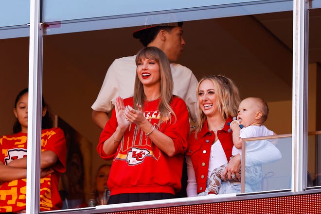 Taylor Swift, left, and Brittany Mahomes look on during a game between the Los Angeles Chargers and Kansas City Chiefs at GEHA Field at Arrowhead Stadium in Kansas City, Missouri.