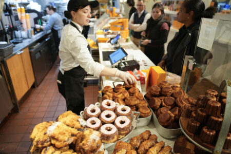 Cronuts, bottom center, are displayed with other pastries at the Dominique Ansel Bakery in New York, Thursday, Sept. 28, 2023. In 2013, before most people knew the term ÔÇ£going viral,ÔÇØ the French pastry chef created the Cronut, a cross between a croissant and a doughnut, at his newly opened New York bakery.