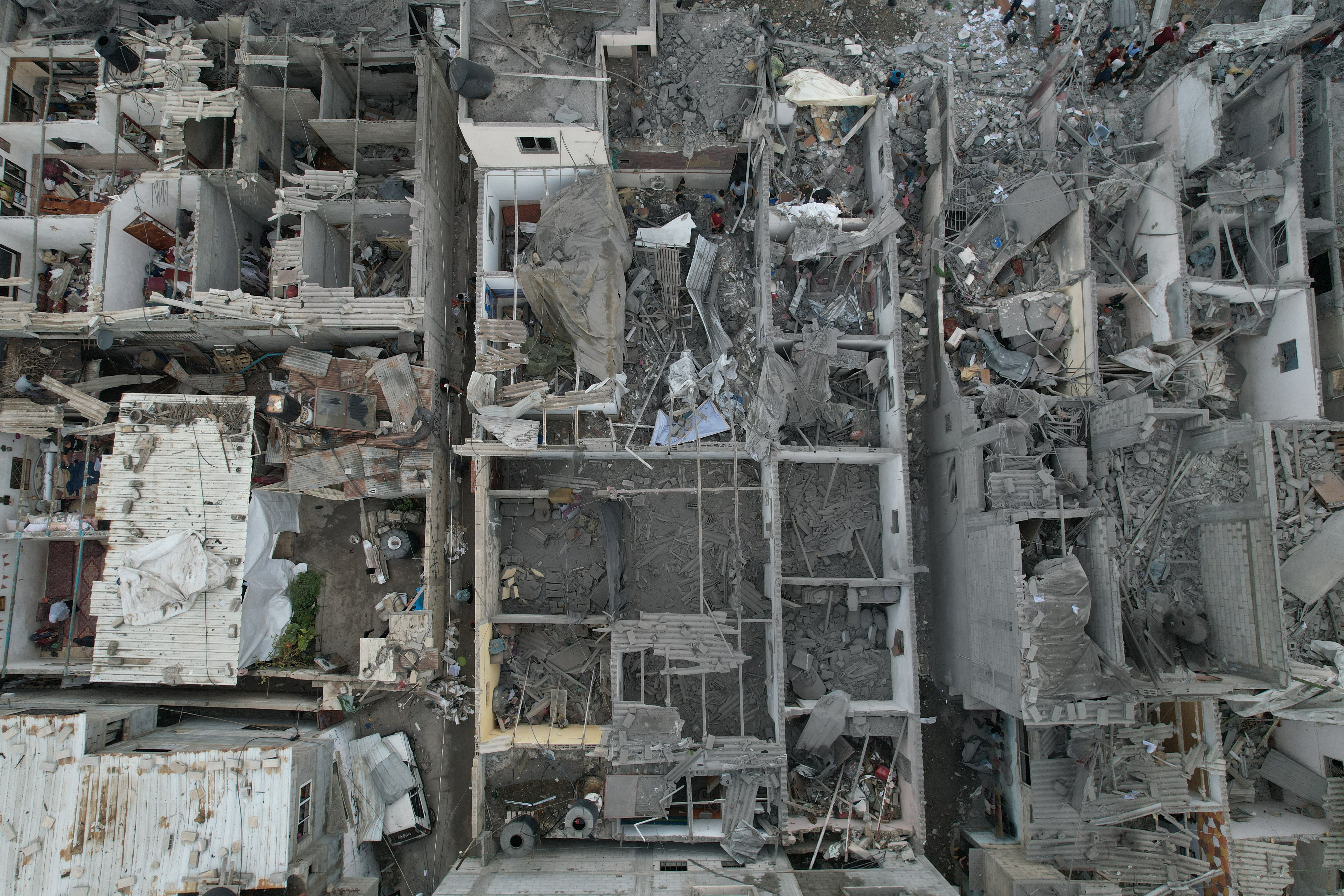 A view of the remains of a mosque and houses destroyed by Israeli strikes in the central Gaza Strip