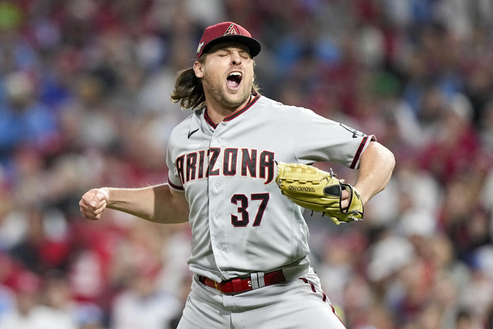Diamondbacks relief pitcher Kevin Ginkel celebrates after the last out of the eighth inning in Game 7 of the NLCS against the Phillies. (AP Photo/Brynn Anderson)