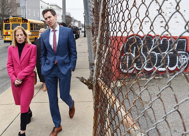 State Rep. Carole Fiola, left, and Congressman Jake Auchincloss take a walk on Pleasant Street in Fall River Tuesday, March 26, 2024 during an event to announce $1,666,279 in funding for Pleasant Street improvements.