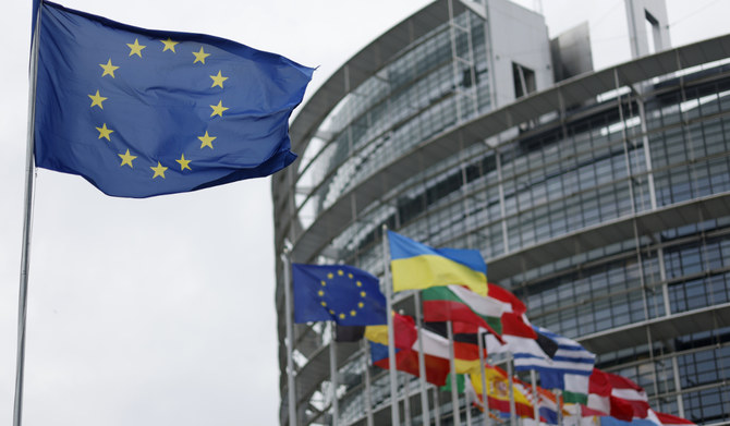 The European flag, left, flies at the European Parliament in Strasbourg, eastern France, on April 18, 2023. (AP)