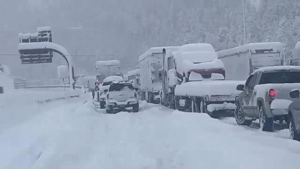 Cars wait for I-70 to open in Colorado's mountains.