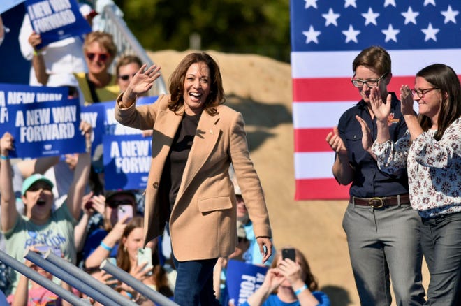 Vice President Kamala Harris takes the stage at Throwback Brewery in North Hampton, cheered by co-founder/co-owner Annette Lee and head chef Carrie Dahlgren, Wednesday, Sept. 4, 2024.