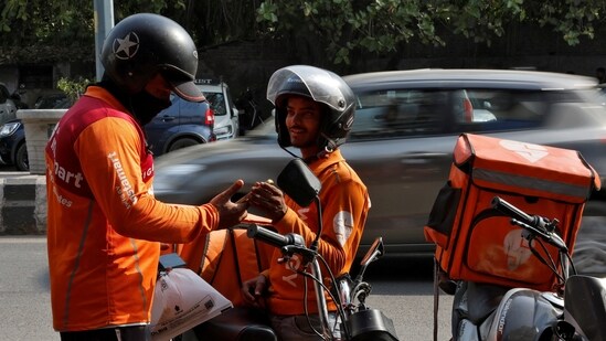 Gig workers preparing to deliver orders outside Swiggy's warehouse