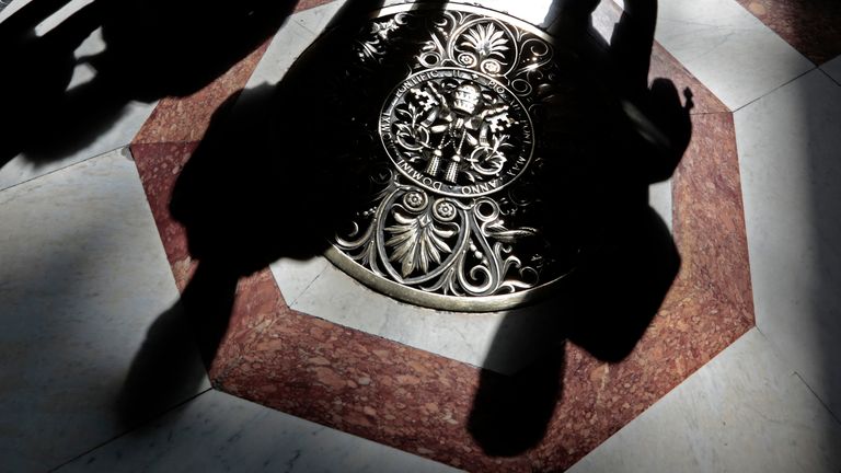 Decoding the Conclave: How AI Legalese Decoder Illuminates the Secretive Process of Selecting the Next Pope 2 A papal crest