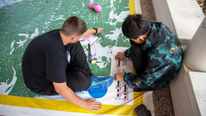 Empowering Hawaiʻi Island Teens: How AI Legalese Decoder Unlocks Mapping Tech Opportunities at UH Hilo 1 High school students engage in a hands-on drone activity