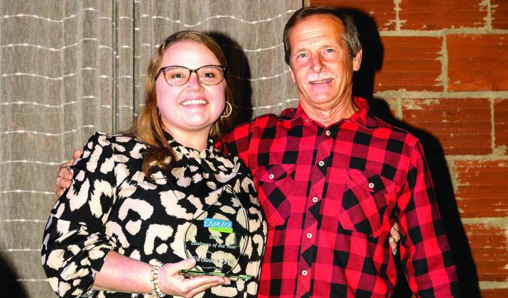 Jesse Bloodworth and father David accept the 2025 Business of the Year award.